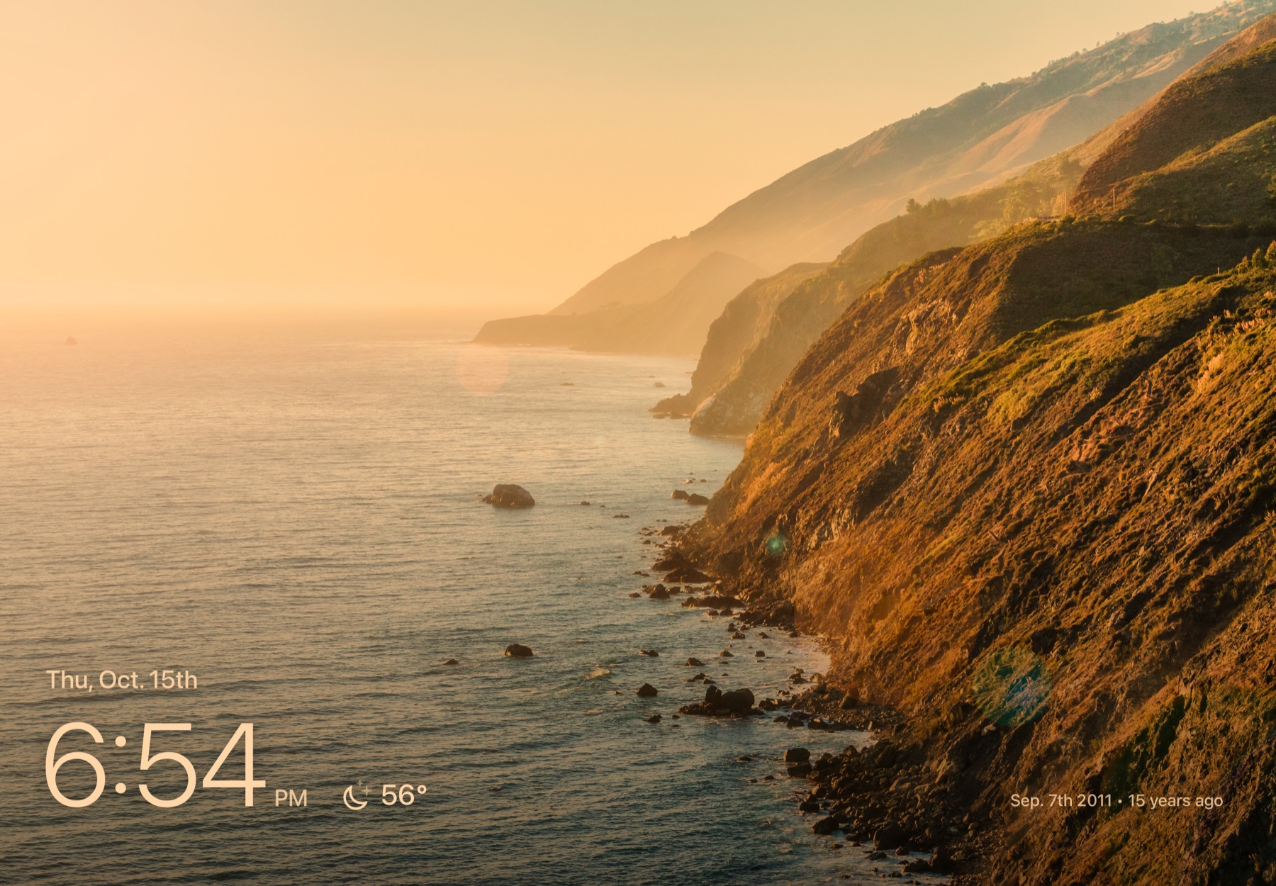 Everglow in Evening Mode: a sunset coastline with a warm tint and a dimmer screen.